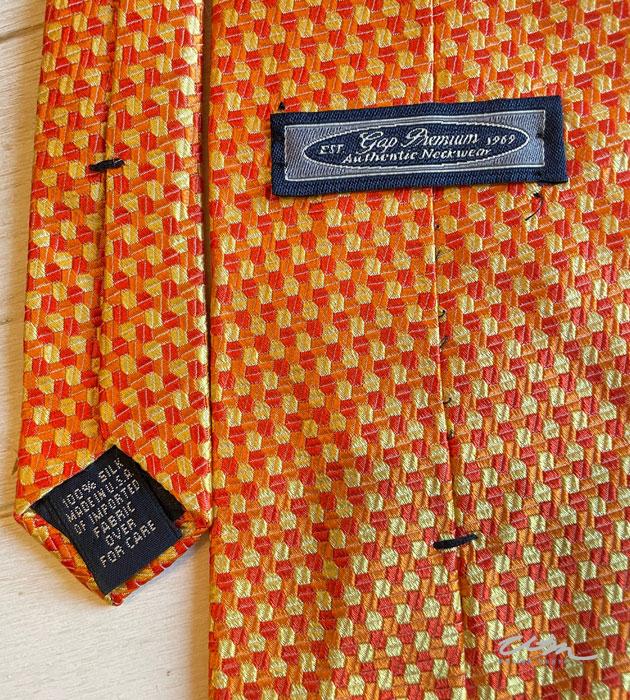 old silk tie with the fabric care label 