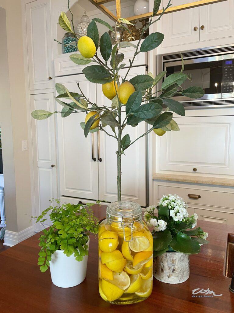 Re-Purpose your Spent Lemons- 29 ways to use old lemons - lemon halves in a jar soaking  in vinegar