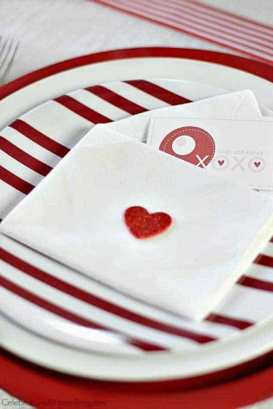Red and white napkins folded to be an envelope for Valentine's Day. 