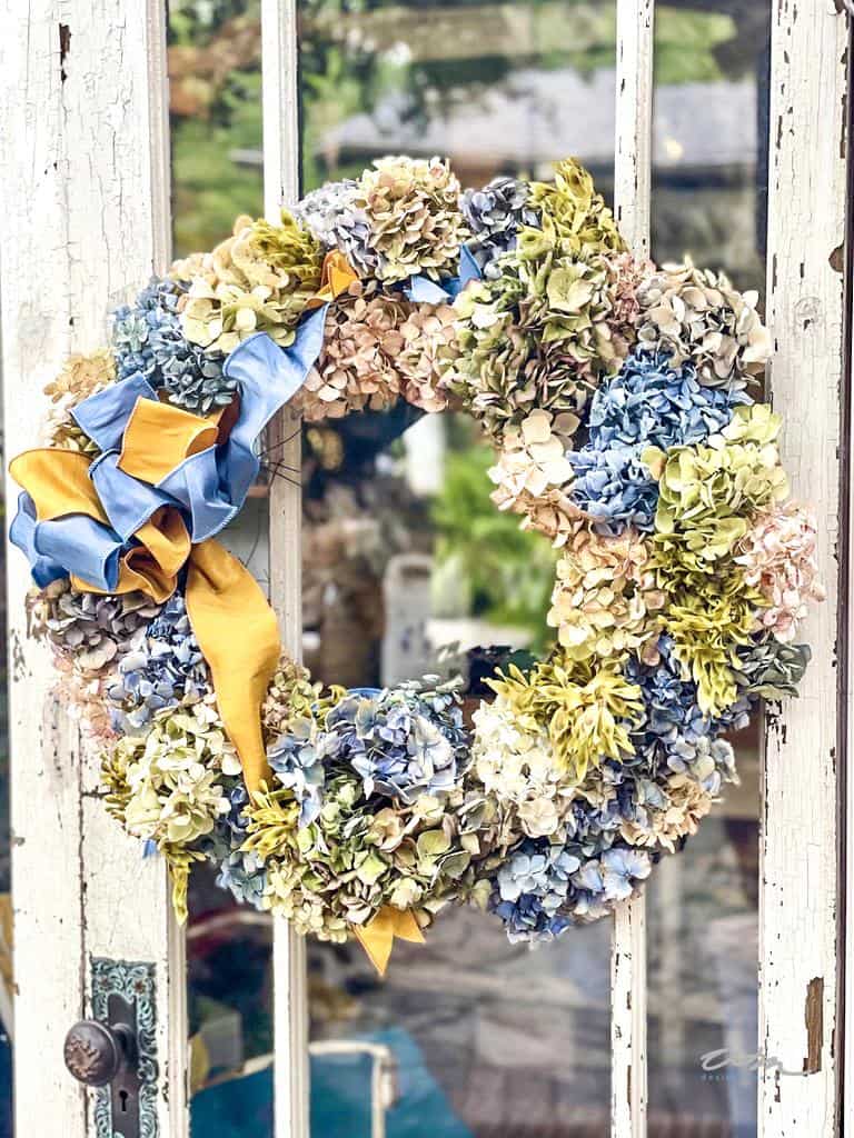 A mix of dried and fresh hydrangeas for a summer mantel