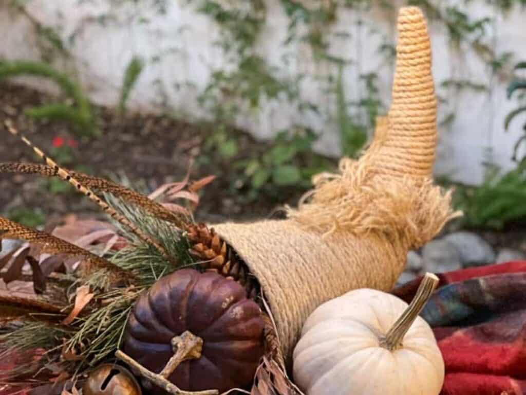 Finished Cornucopia basket with pumpkins and gourds.