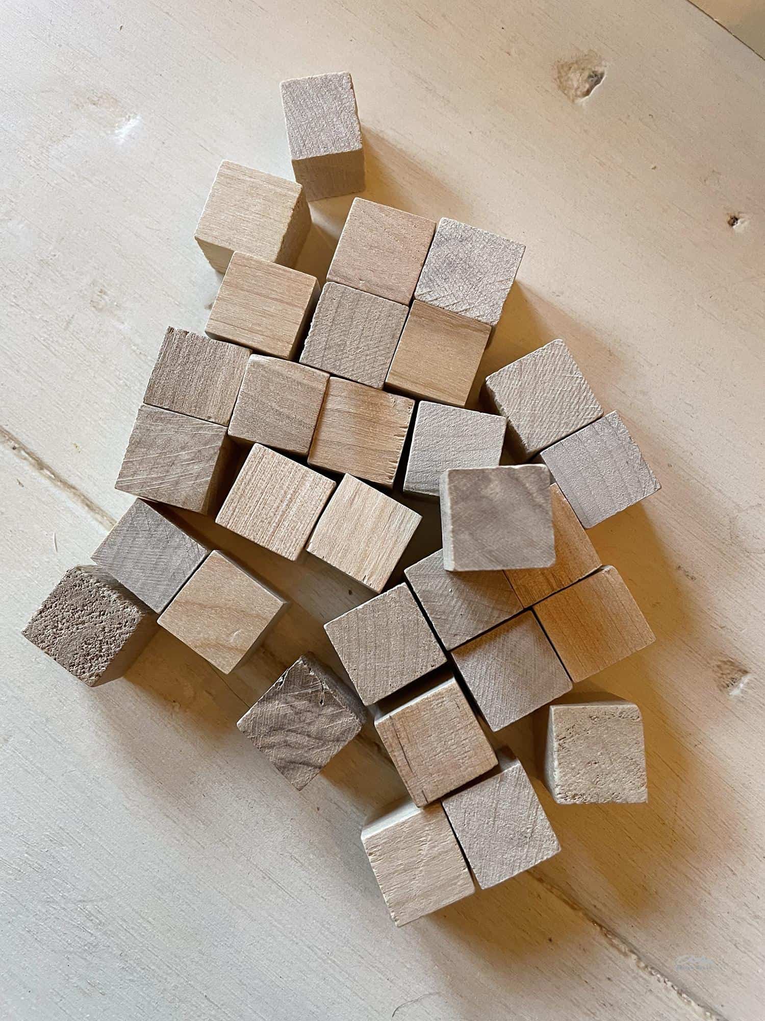 Small wood cubes to be used as handles for boxes as part of a DIY advent calendar for Christmas