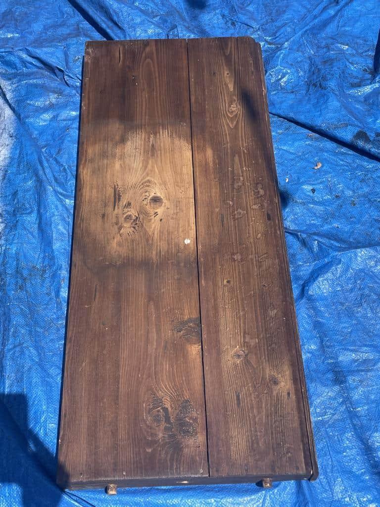 Once you have scrubbed all of the stain off, you can rinse the piece with the hose as long as the piece is solid wood. Next, let the piece sit in the sun to dry. 