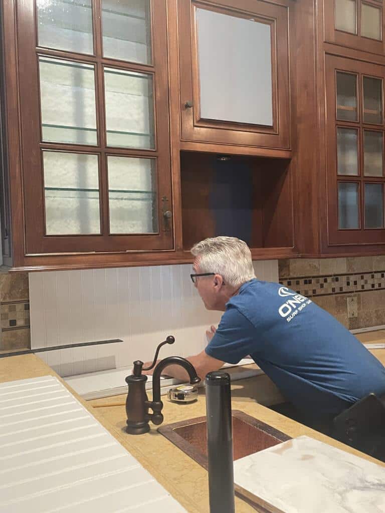 installing backsplash on our coffee and wine bar renovation one room challenge