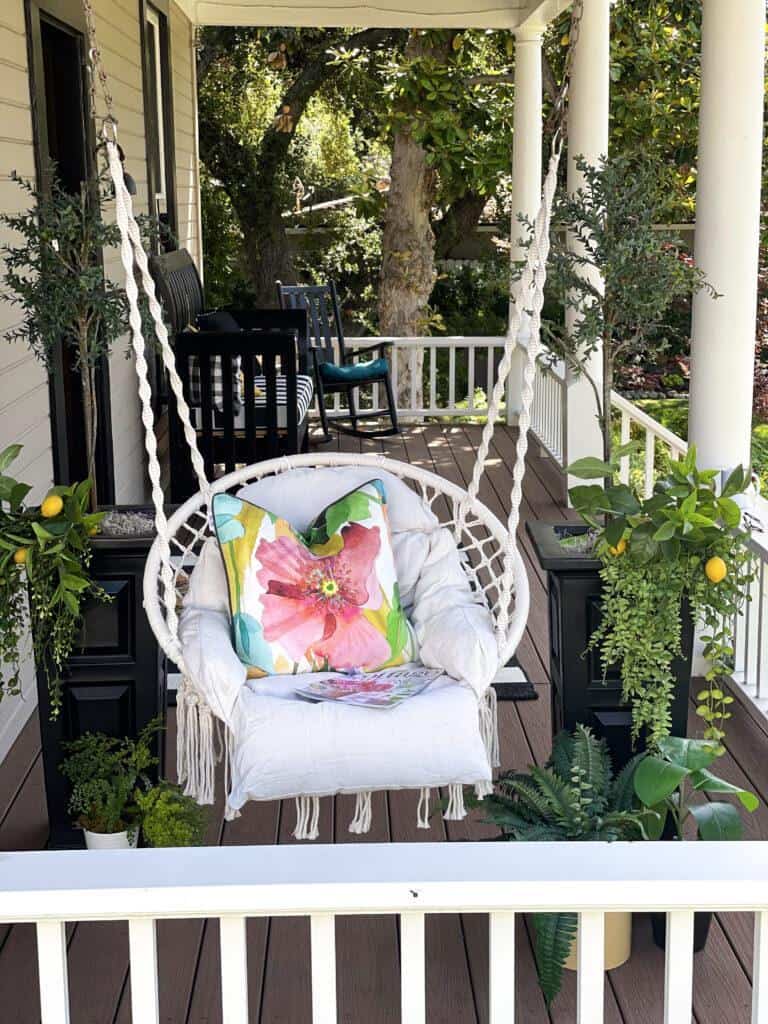  summer decorating the front porch with cushions and swing 