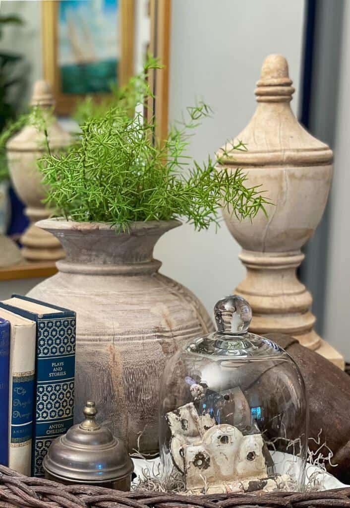Using old books for decor with wood accessories and vintage items for summer decorating 