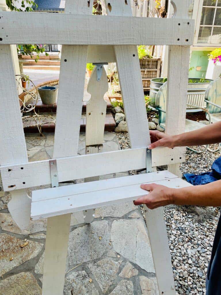 Upcycle a picket fence
- attaching the shelf to the easel.