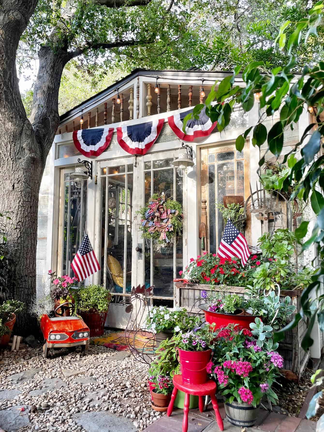 Decorating with American Flag buntings on an outdoor garden shed