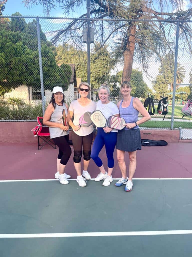 Girls playing pickleball 