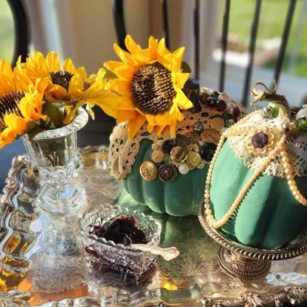 Green painted pumpkins with buttons and lace