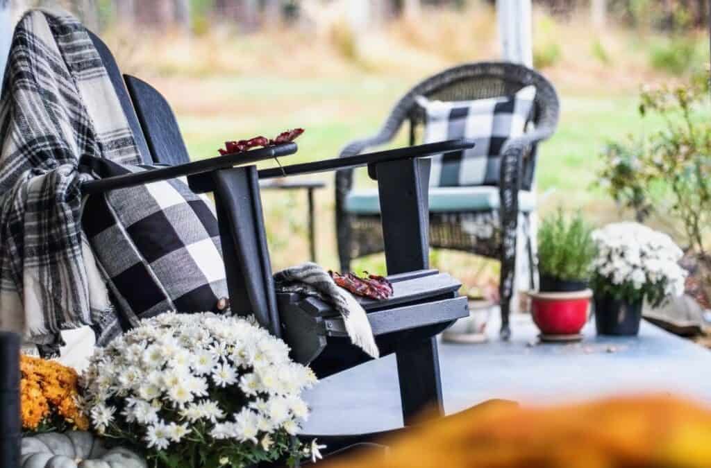 Having a blanket or two on the porch is perfect for fall decor on a budget.