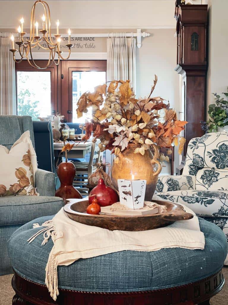 Fall vignette styled on the coffee table in the family room. flowers, candles books and more. 