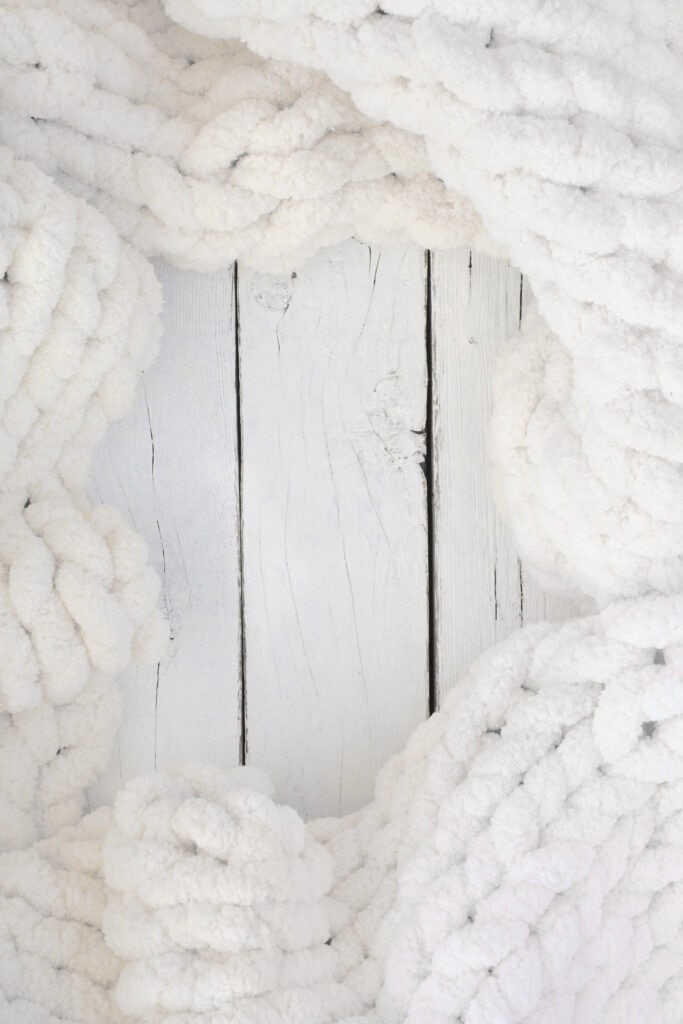 A chenille blanket in off-white. The best yarn to make a chunky blanket with. 