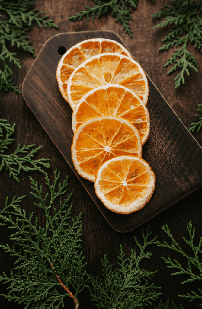 Dried orange slices on wooden cutting board at Christmas