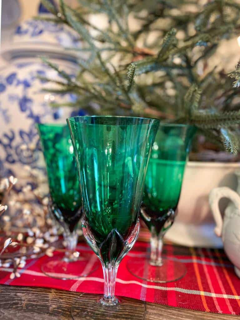 Vintage green goblets sitting on the sidebar of the dining room. 