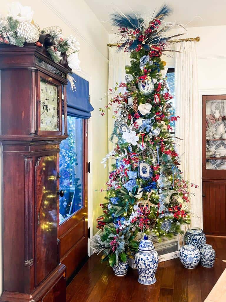 The Christmas Tree is decorated in blue and white china with red accents.