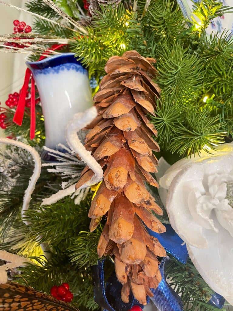 pine cones on the blue and white Christmas tree 