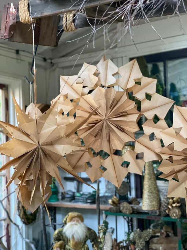 Brown paper snowflakes in the sheshed 