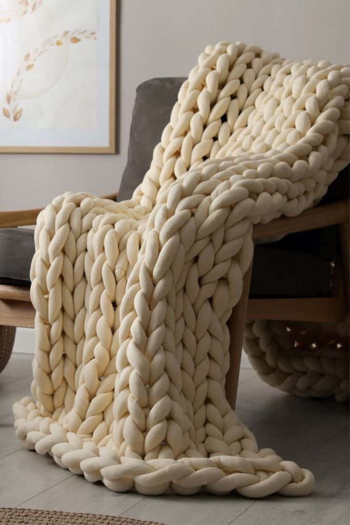 What is the best chunky yarn to use for a blanket?- yarn blanket draped over a chair.