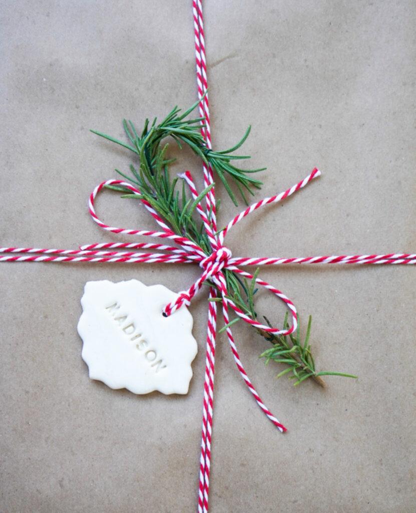 candy cane  made out of Rosemary on a gift package