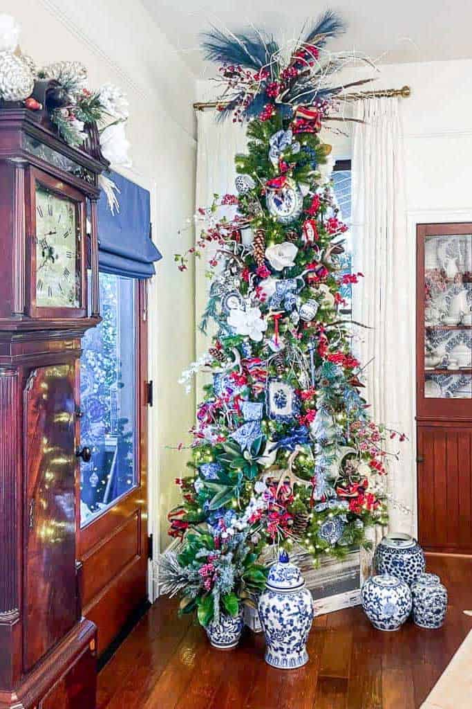  Christmas decoration theme ideas-Blue and white chinoiserie tree in the dining room with china on the tree.