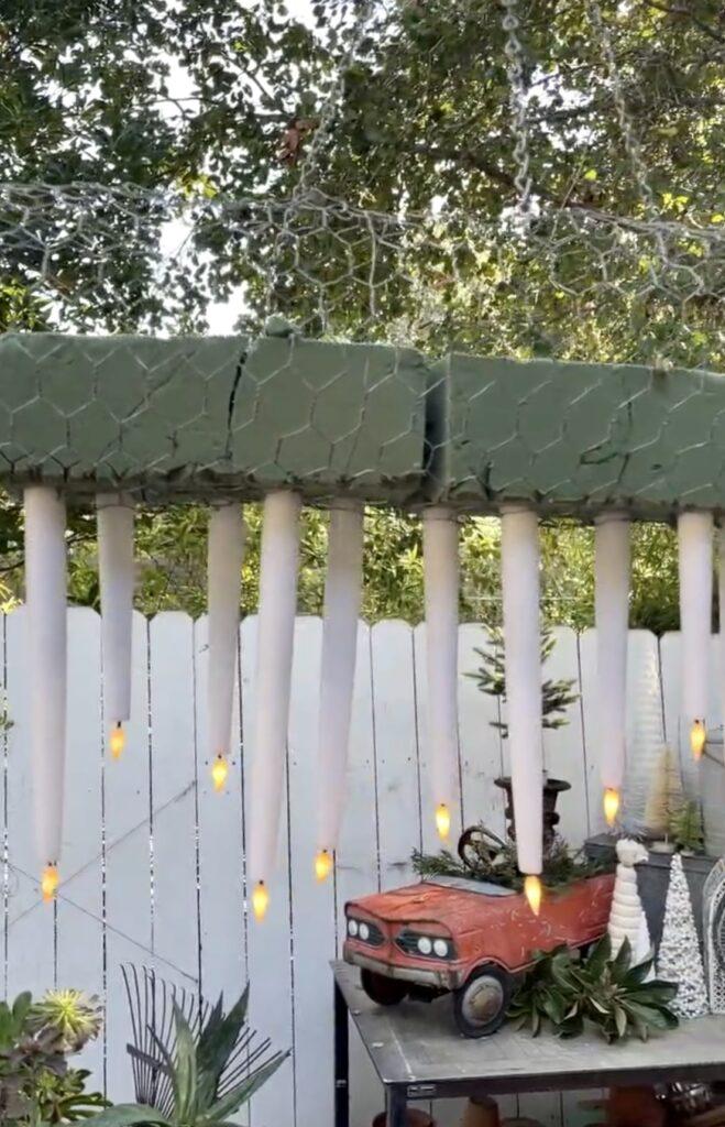 Battery operated candles put into dry foam for hanging outdoor chandelier
