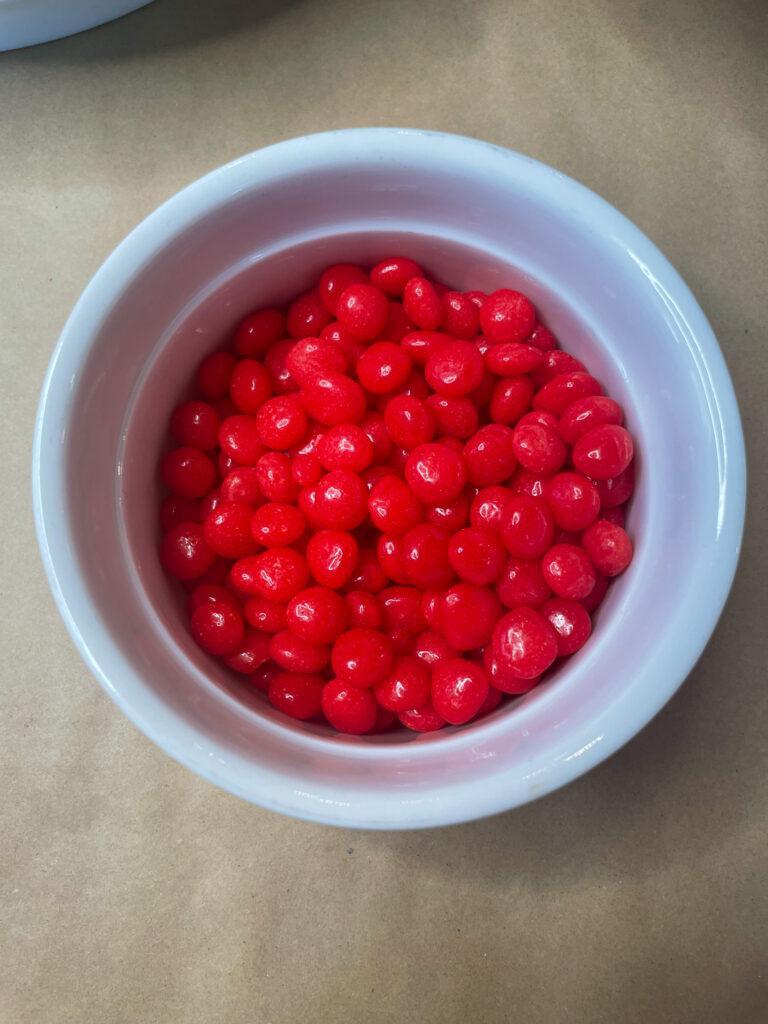red hots to use for berries on your marshmallow Christmas trees
