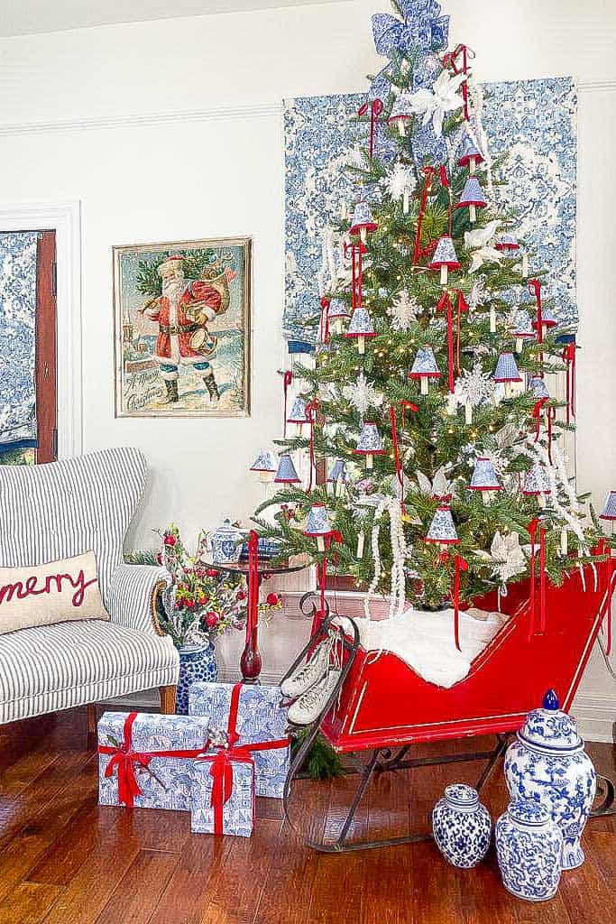  Christmas decoration theme ideas-A tree decorated in blue, red and white with small lampshades on the candles. 