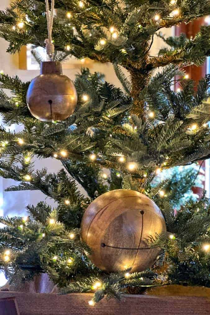 Wooden jingle bells hanging in the tree 