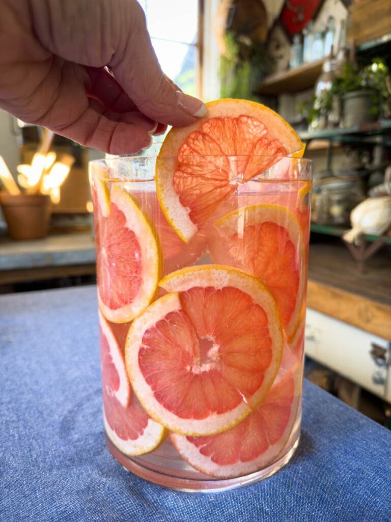 Clear glass vase with grapefruit slices 