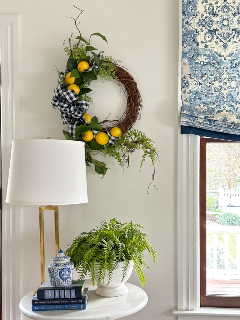 Fresh lemon wreath hanging on the wall in the living room
