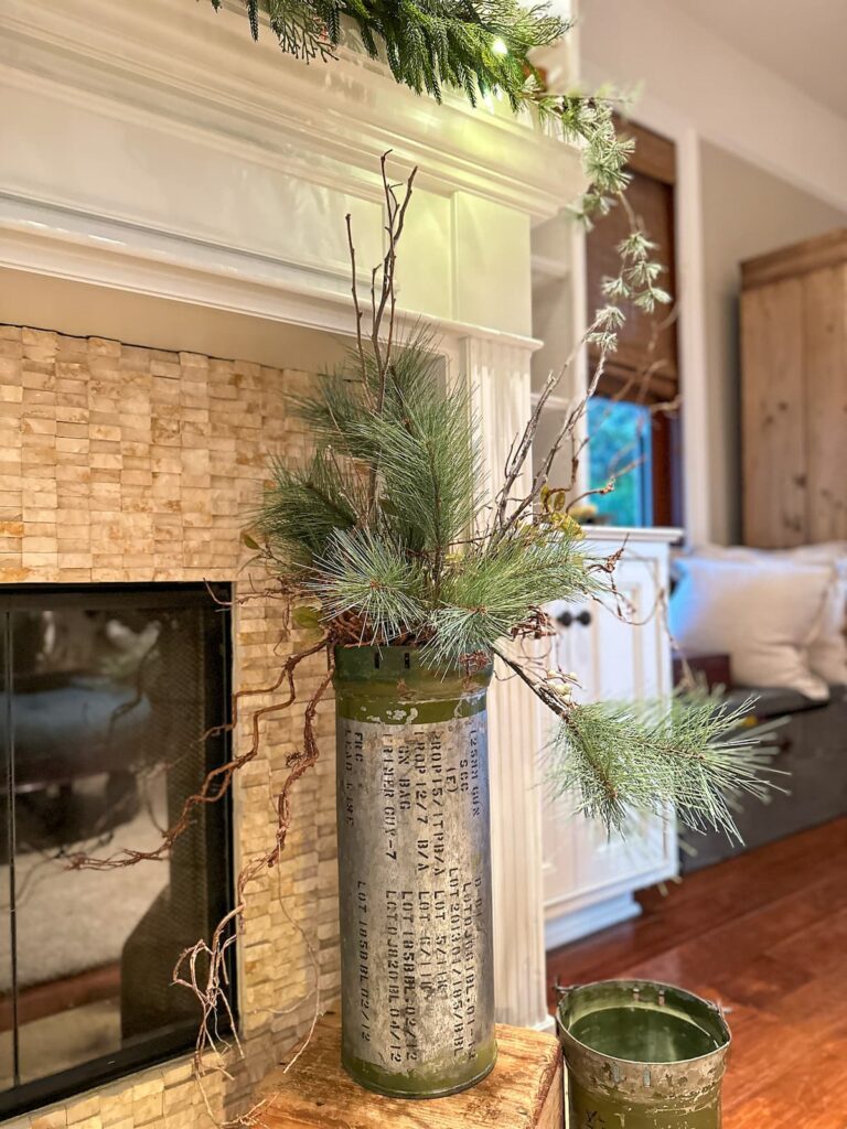 green pines in a can on the harth- Winter floral arrangement