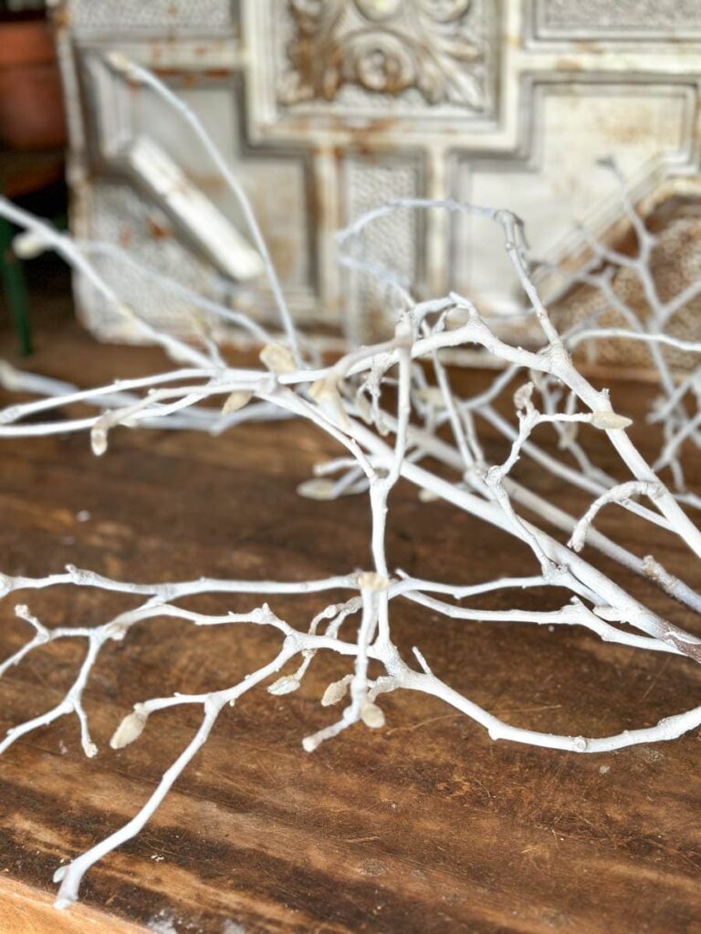 Tree branches painted white for making a Valentine's Day Tree