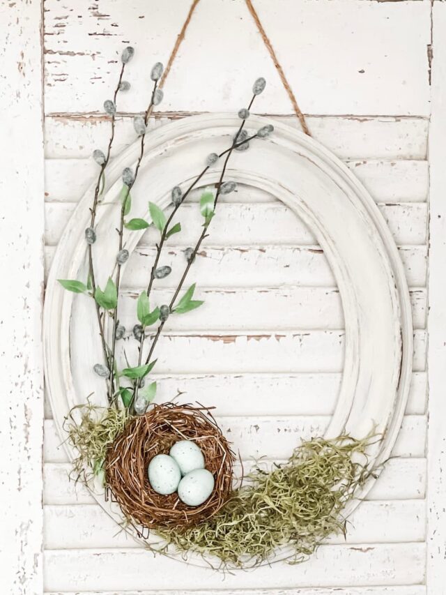 white frame with birdsnest for spring decor