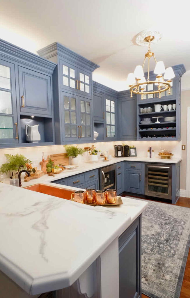 Butlers pantry design ideas and tips  with blue cabinets and white counter tops 