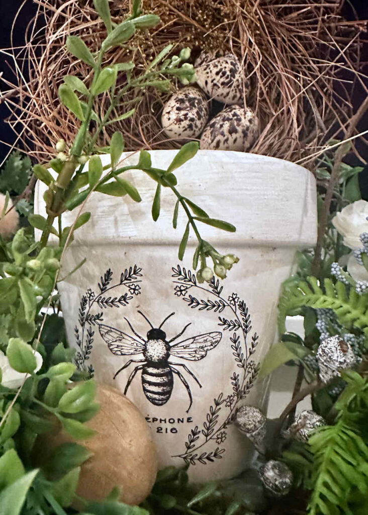 spring mantel ideas-Clay pot painted with bee transfer