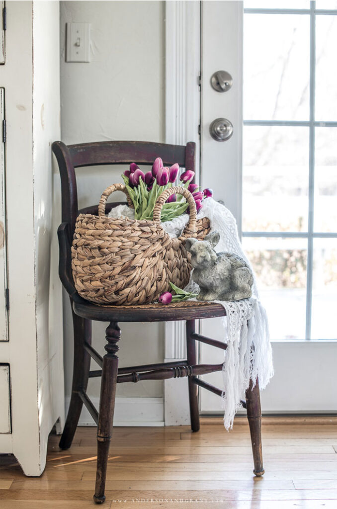 Chair with a basket of purple tulips 