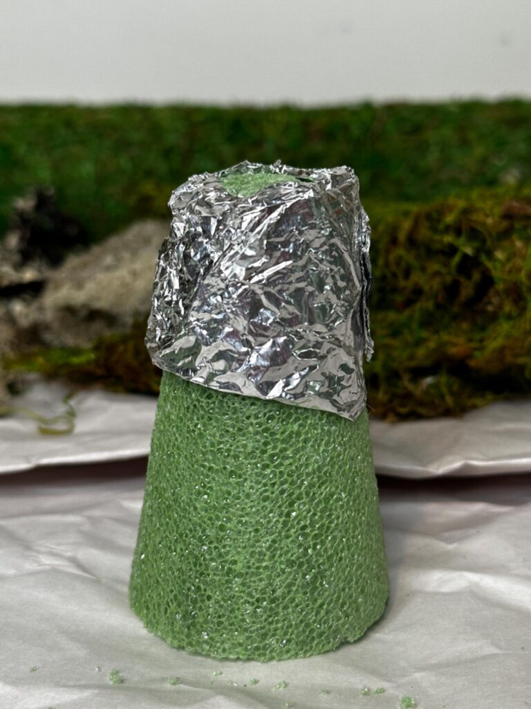 Styrofoam cone with foil wrapped arond the top 1/3.