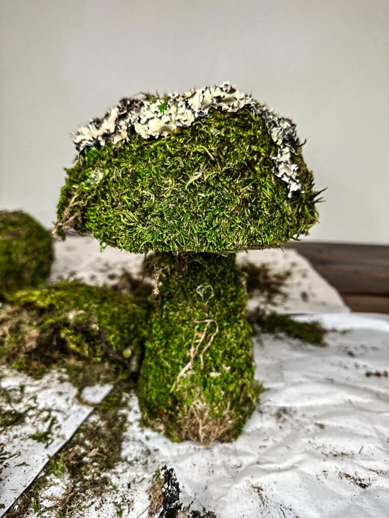 Green moss mushroom on craft table after DIY process
