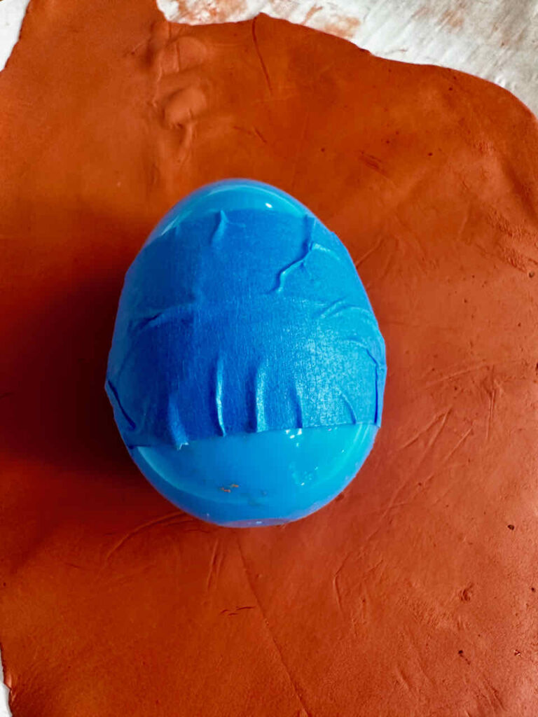 DIY Easter Rabbit- Easter egg and clay used to create a rabbit head 