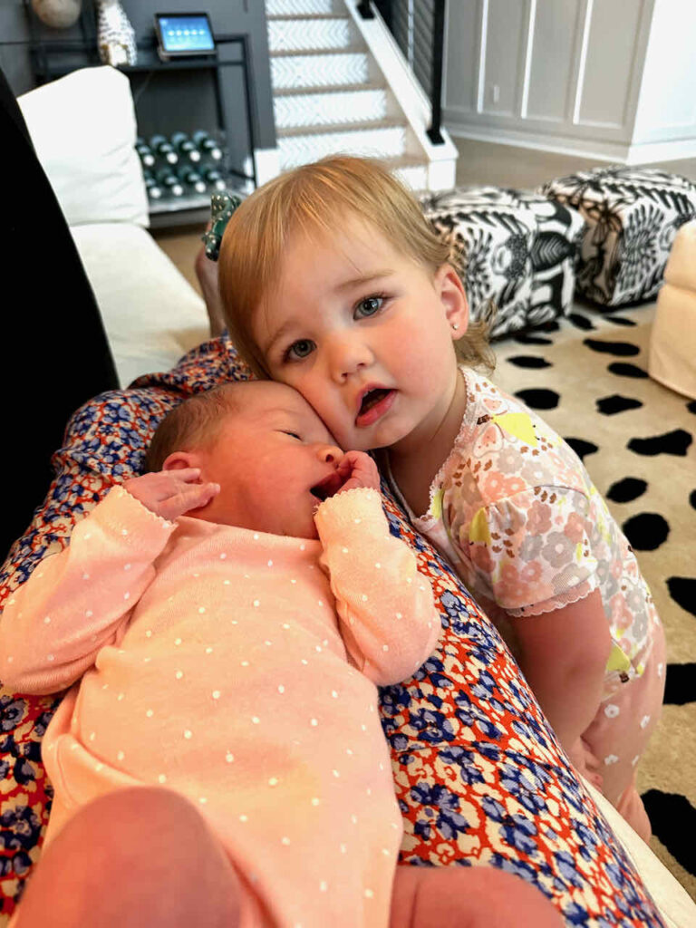 Little girls with new baby sister 