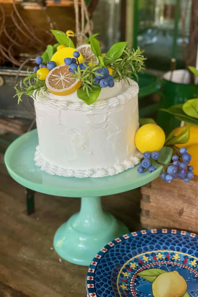 29 things to do with your extra lemons-cake decorated with lemons on a green cake stand 