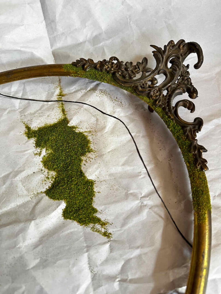 How to Make An Easy DIY Moss Frame Wall Art Gallery-A vintage metal oval frame with scroll work at the top. 