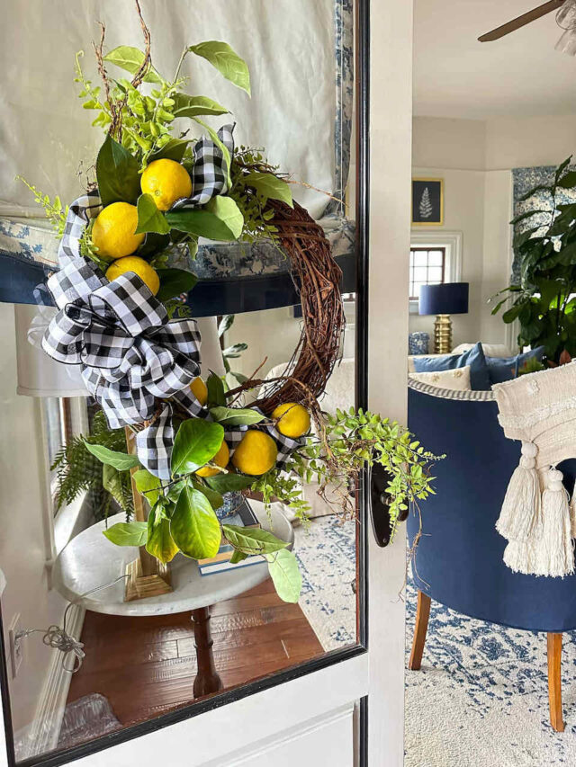 A fresh lemon diy wreath hanging on the door 