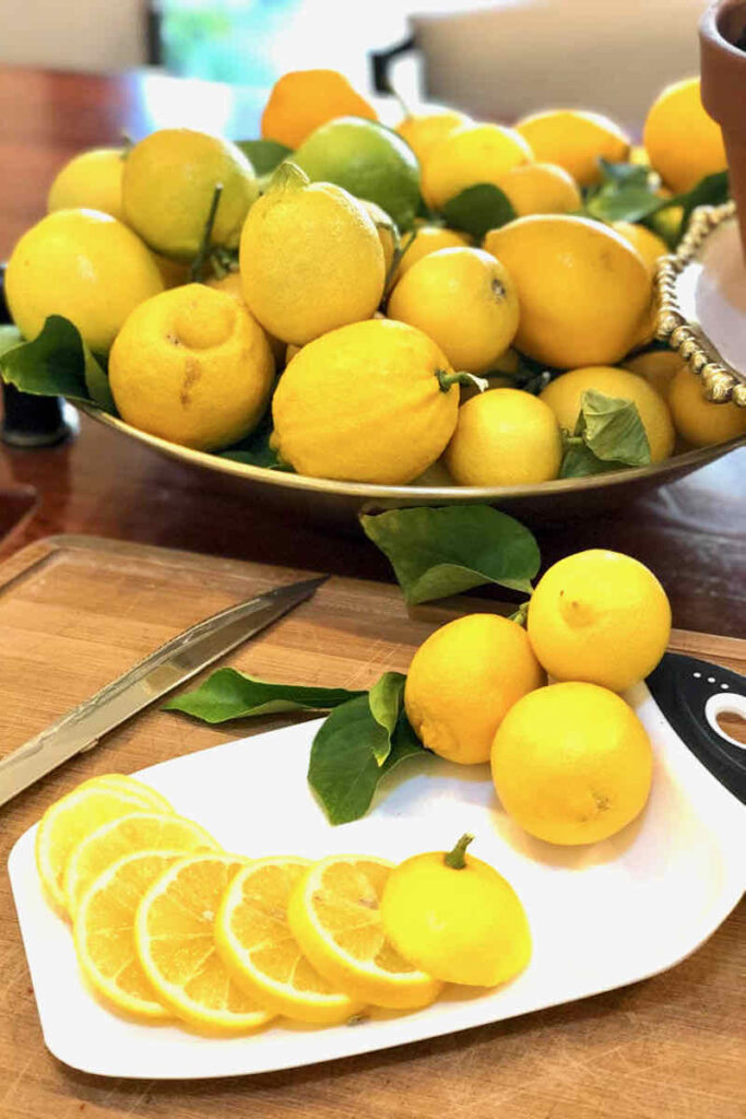 29 things to do with your extra lemons-lemons sliced on a cutting board 