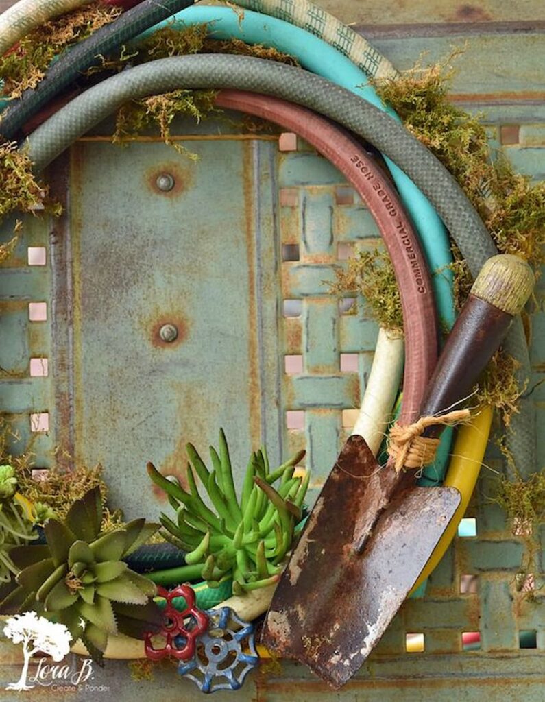 How To Make 27 Unique Summer Front Door wreaths And More-A wreath made out of old garden hoses with a vintage shovel and other garden decor. 