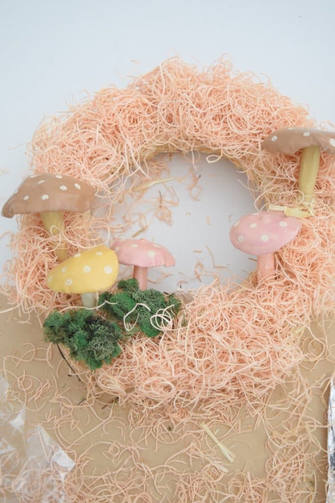 Pink exclsius wreath with diy clay mushrooms that are hand painted 