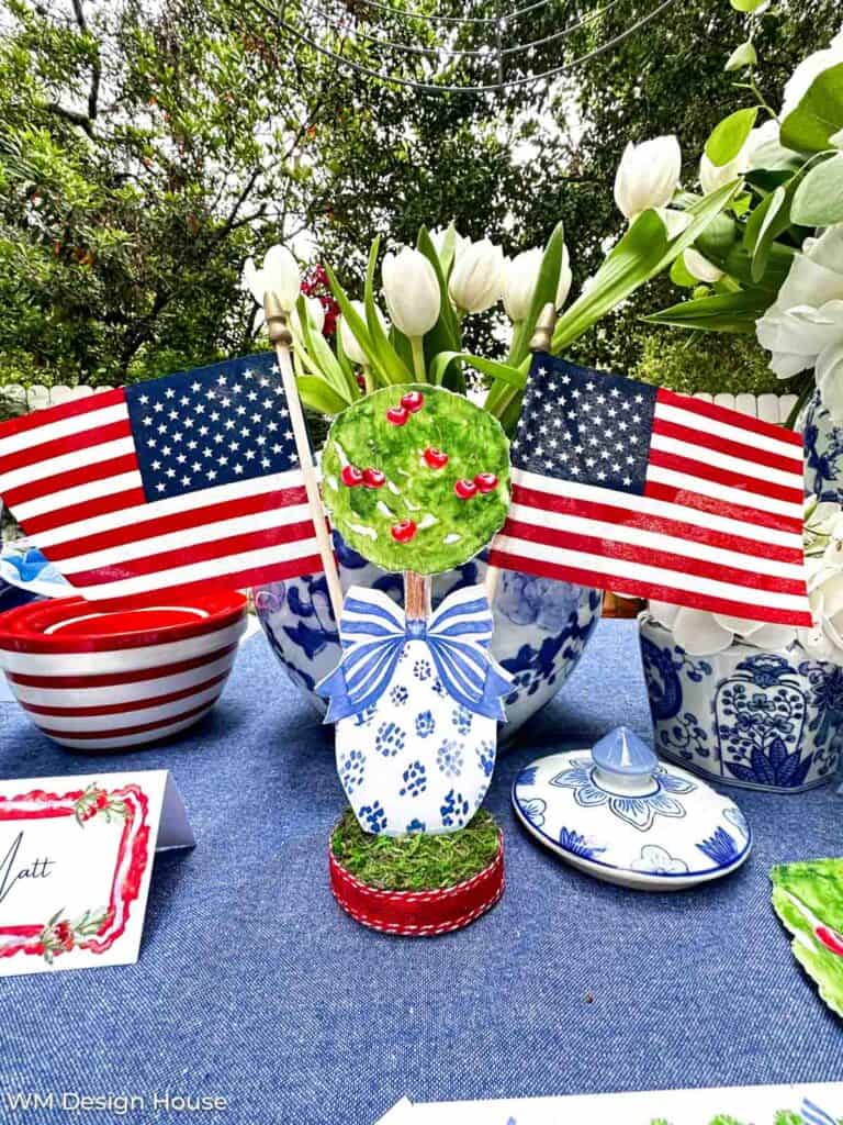 Free dinner party printables, topiary tree with two small flags inserted for the fourth of July 