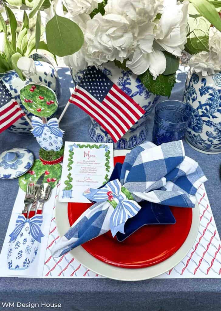 place setting with red plate, blue and white checkered napkin with free printable place mat and napkin ring 