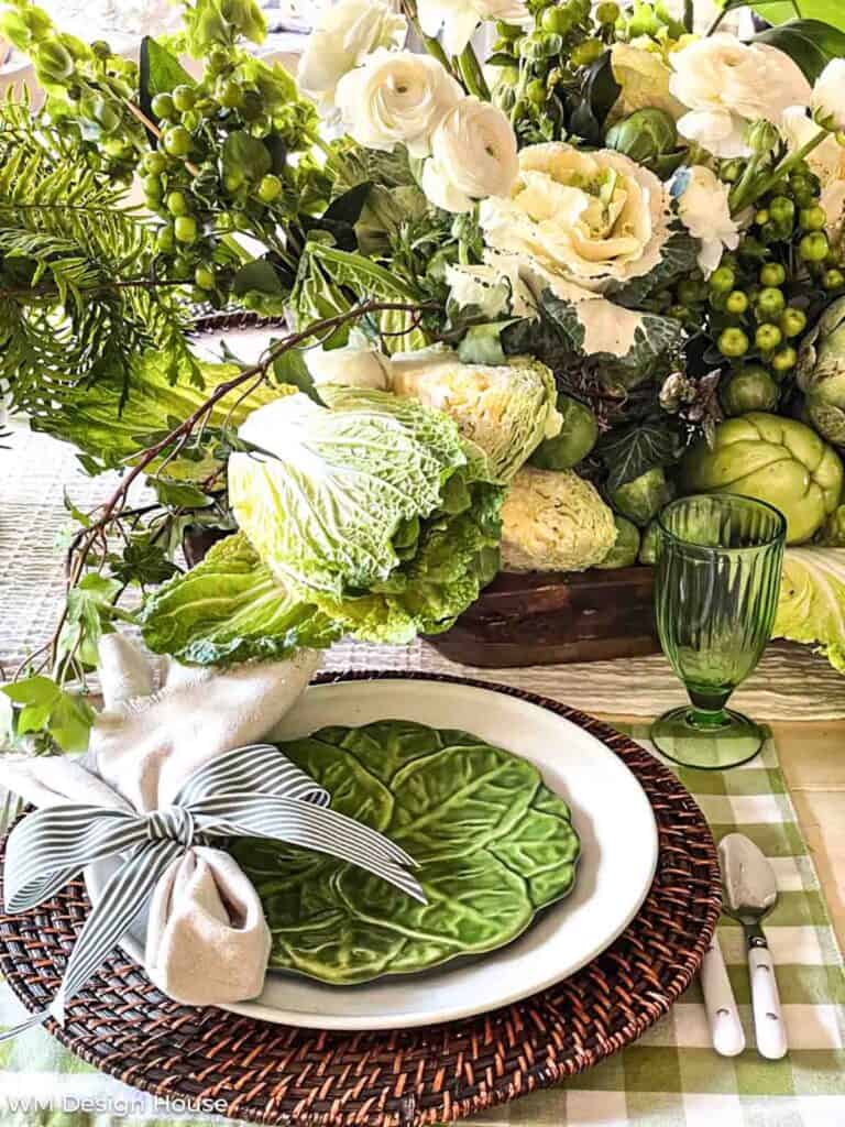 Green table centerpiece filled with cabbage and green flowers for st patricks day